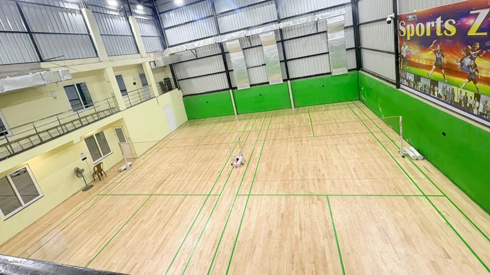 Elevated wide-angle view of the Badminton courts at Sports Zone LLP, Patna