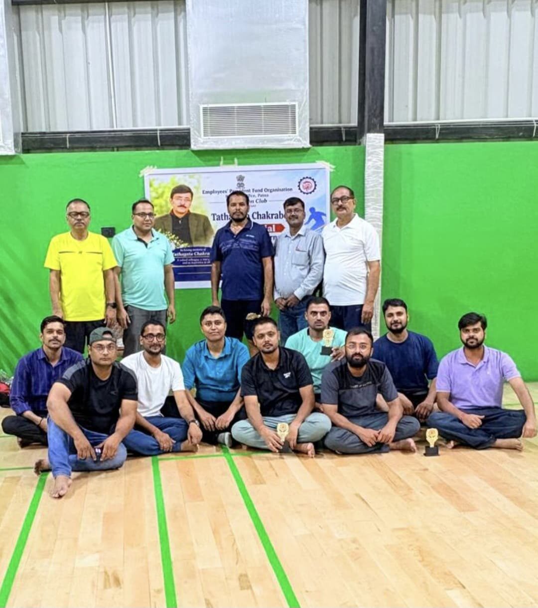 Winners and organisers posing with trophies at a Badminton tournament hosted at Sports Zone LLP, Patna