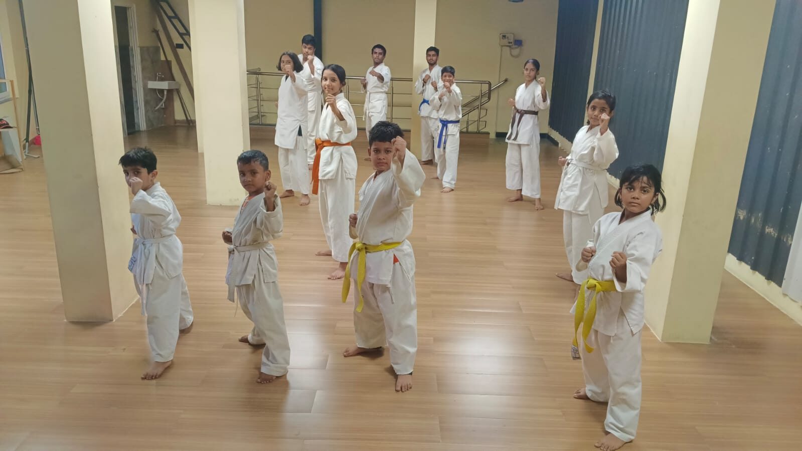 Full batch of Judo and Karate students in fighting stance at Sports Zone LLP, Bailey Road, Patna