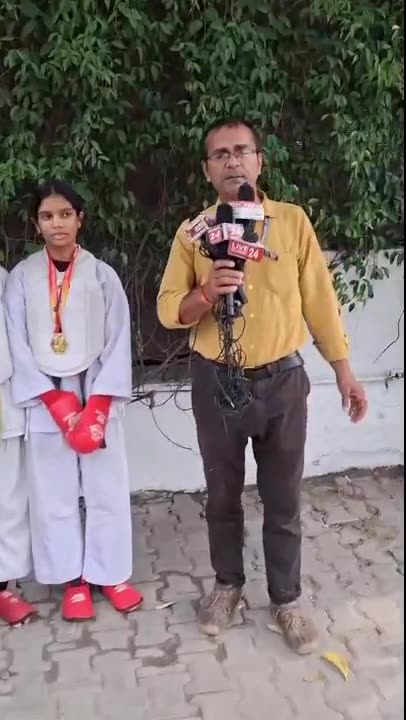 Video of a news channel reporter interviewing Sports Zone LLP Karate medallists and their coach