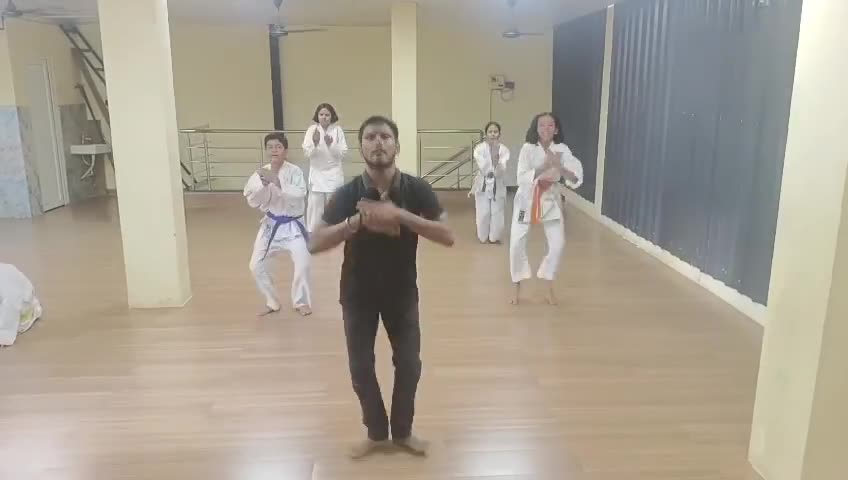 Video of a Karate coach leading students through a warm-up fitness drill at Sports Zone LLP, Patna